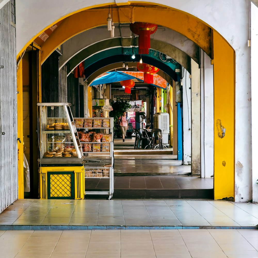 a yellow and white building with a yellow and blue door