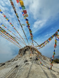 a mountain covered in lots of colorful flags
