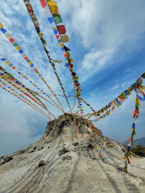 a mountain covered in lots of colorful flags