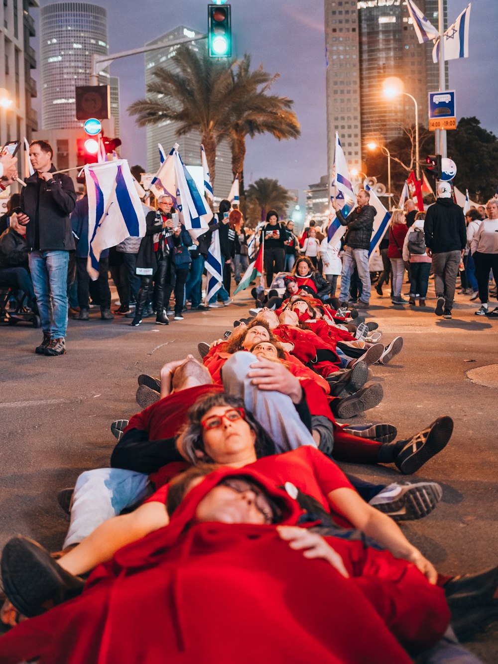 a group of people laying on the street