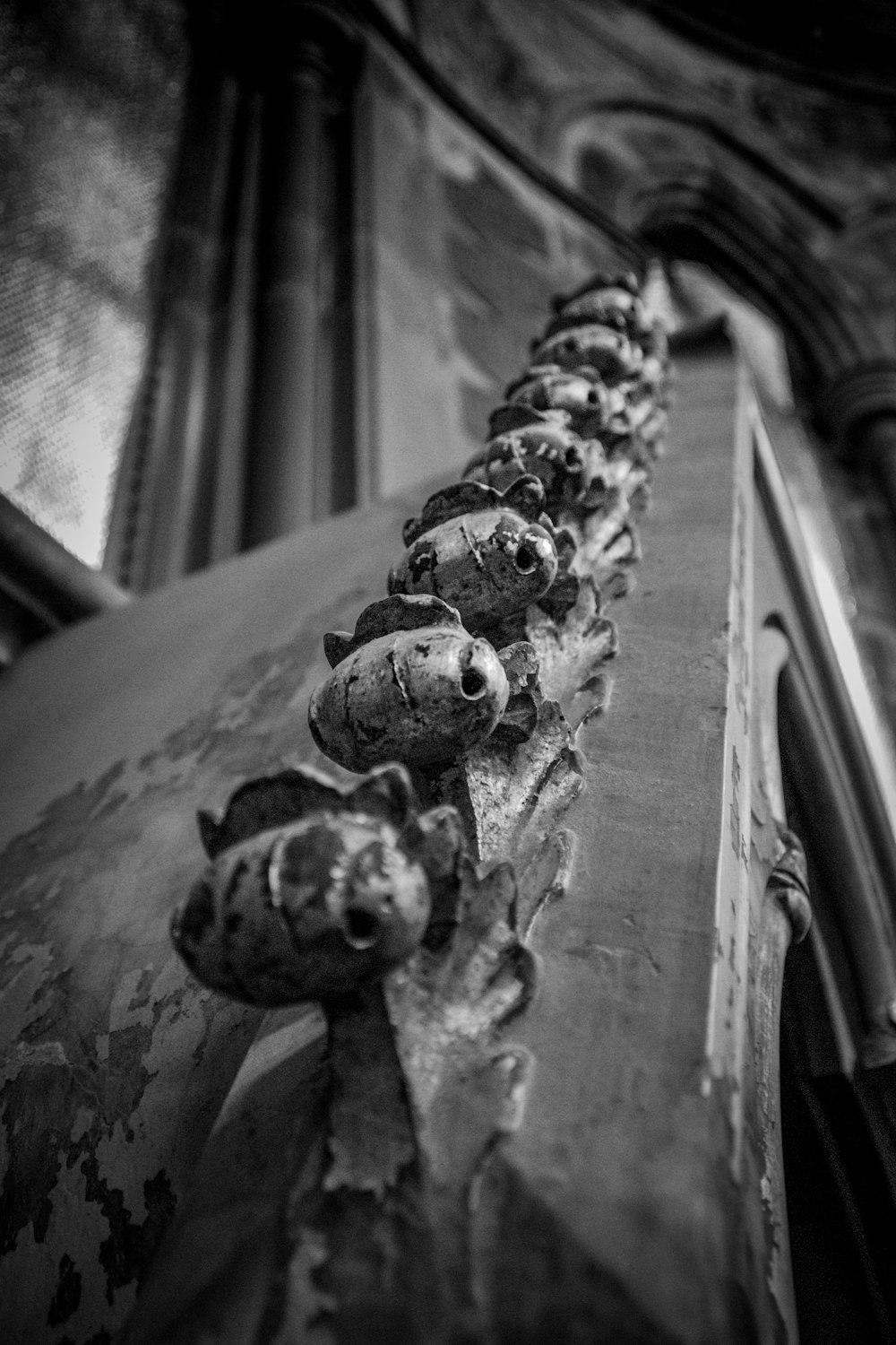 a long line of old metal objects on a building