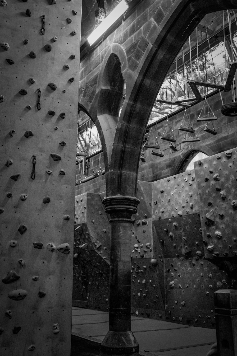 a black and white photo of a climbing wall