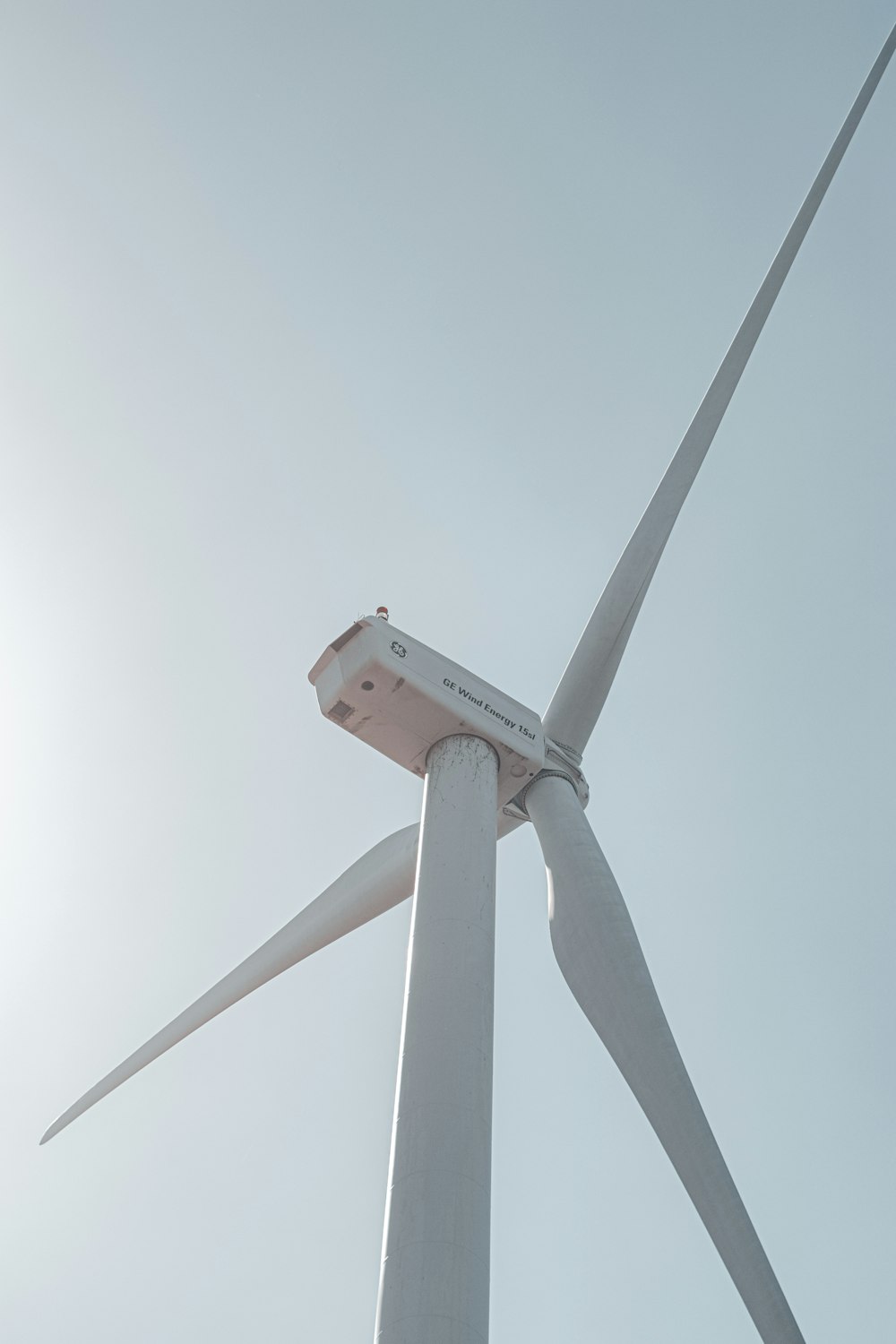 a close up of a wind turbine on a sunny day