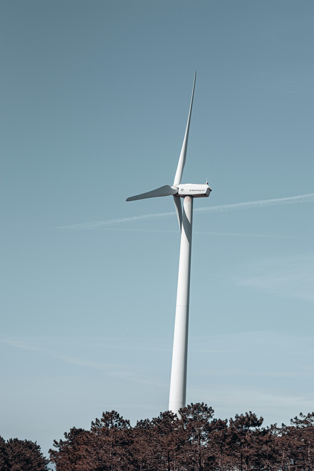 a wind turbine in the middle of a field