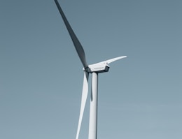 a wind turbine in the middle of a field