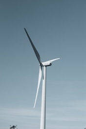 a wind turbine in the middle of a field