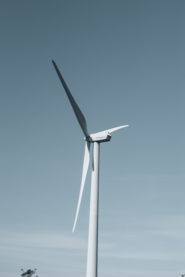 a wind turbine in the middle of a field