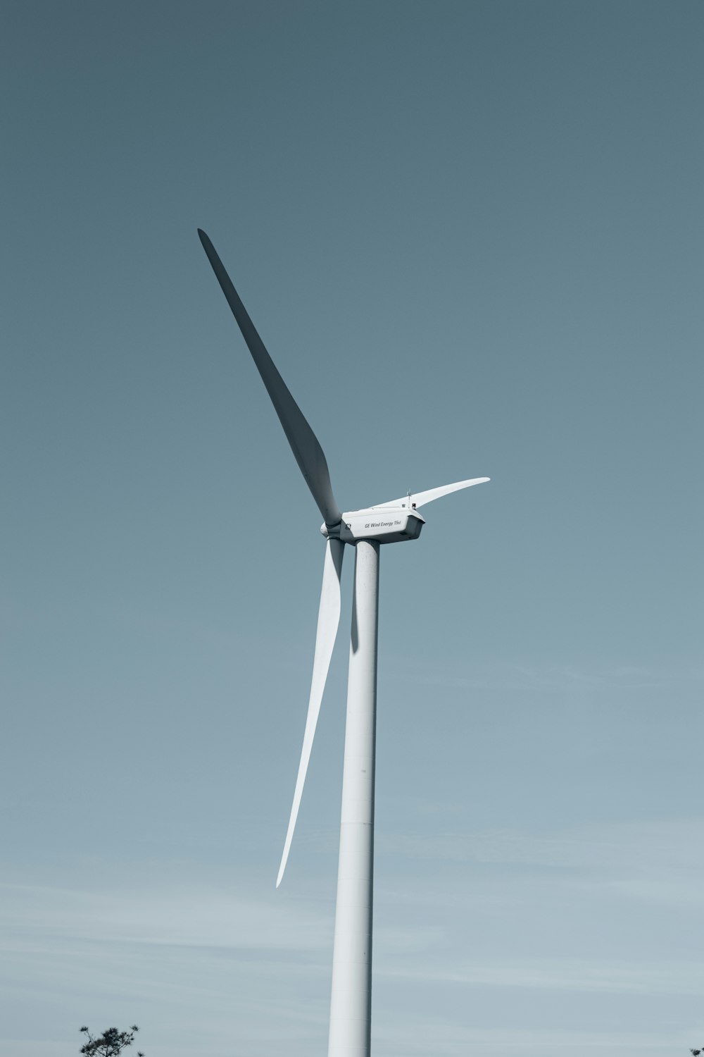 a wind turbine in the middle of a field