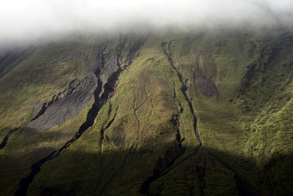 a very tall mountain with a very steep side