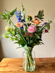 An arrangement of assorted flowers in a vase.