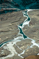 an aerial view of a river running through a valley