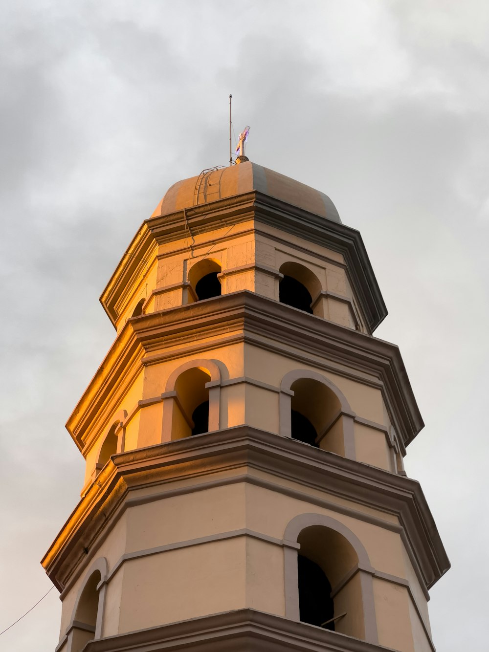 a tall tower with a clock on the top of it