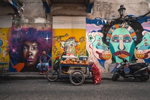 Colorful street art in Cartagena’s historic district with a model posing naturally