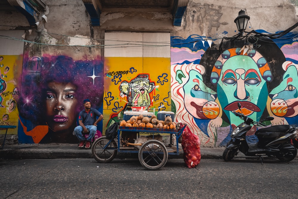 a street scene with a person sitting on a motorcycle