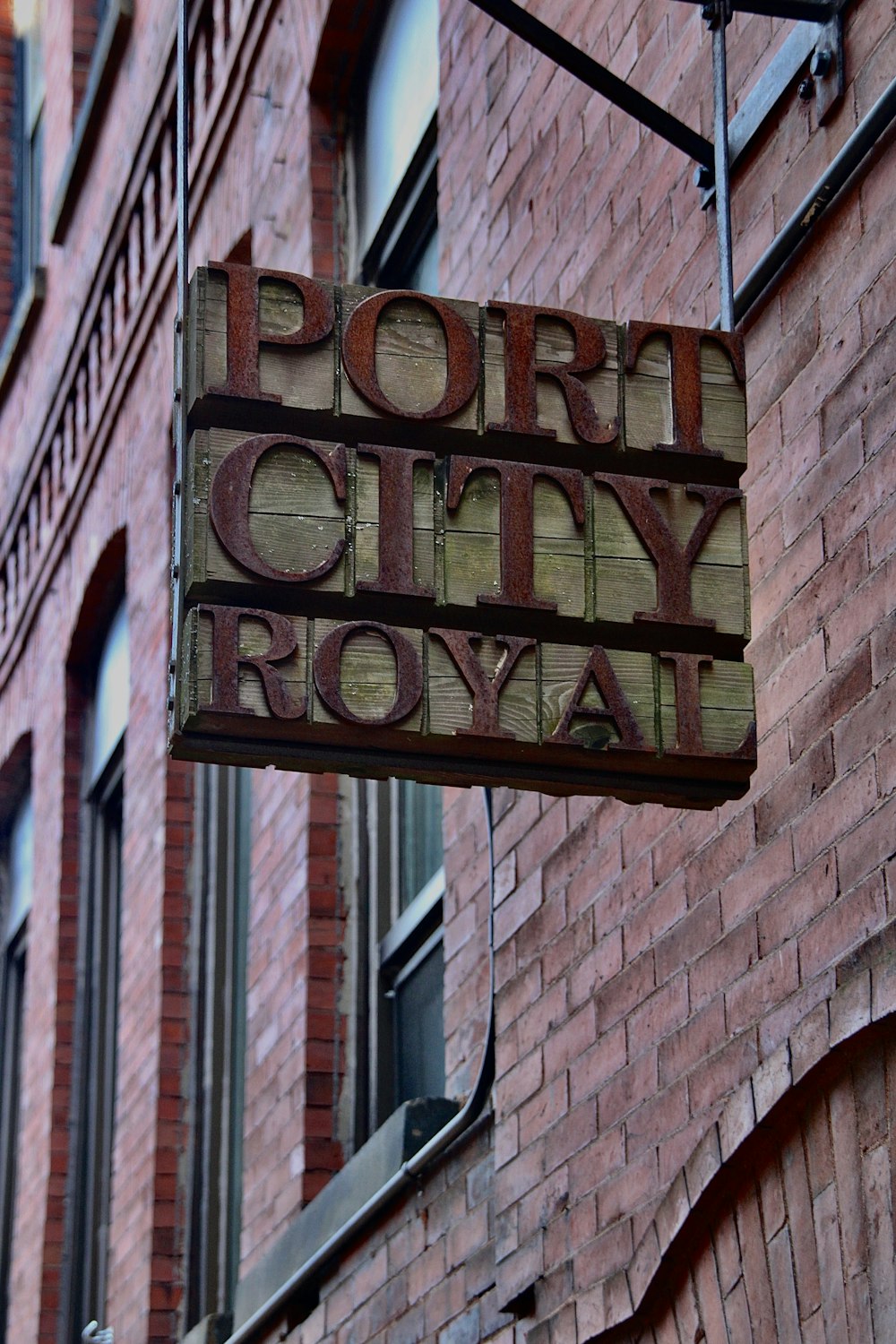 a brick building with a sign that says port city royal