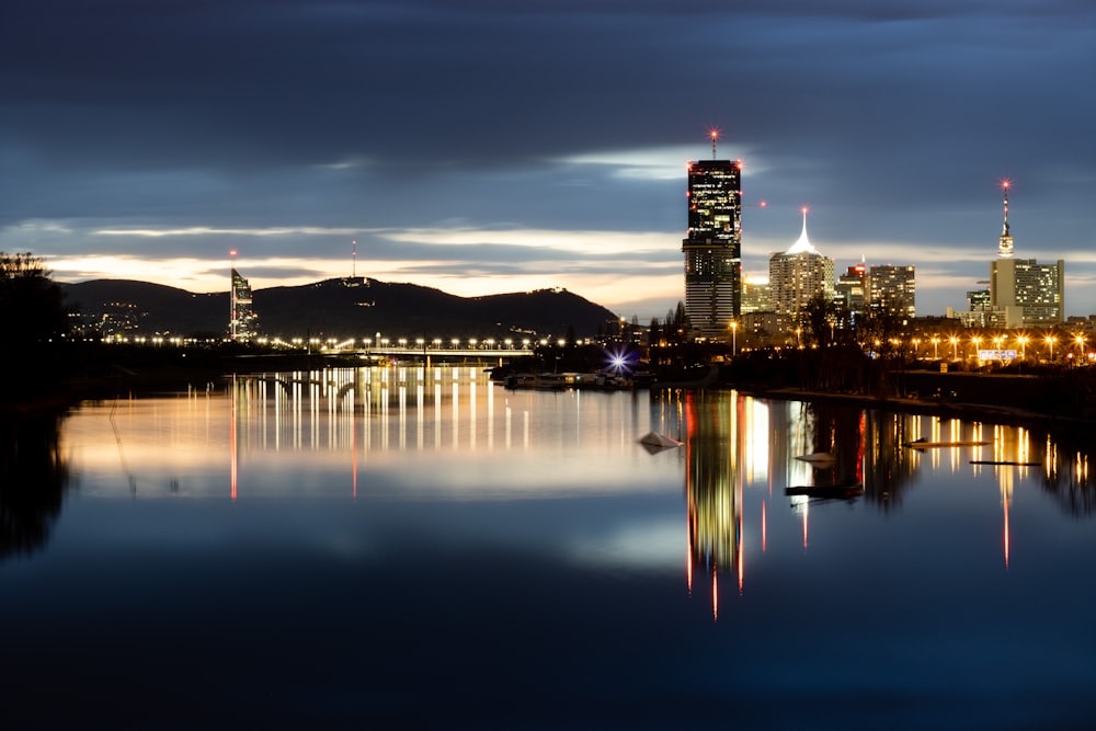 a large body of water with a city in the background