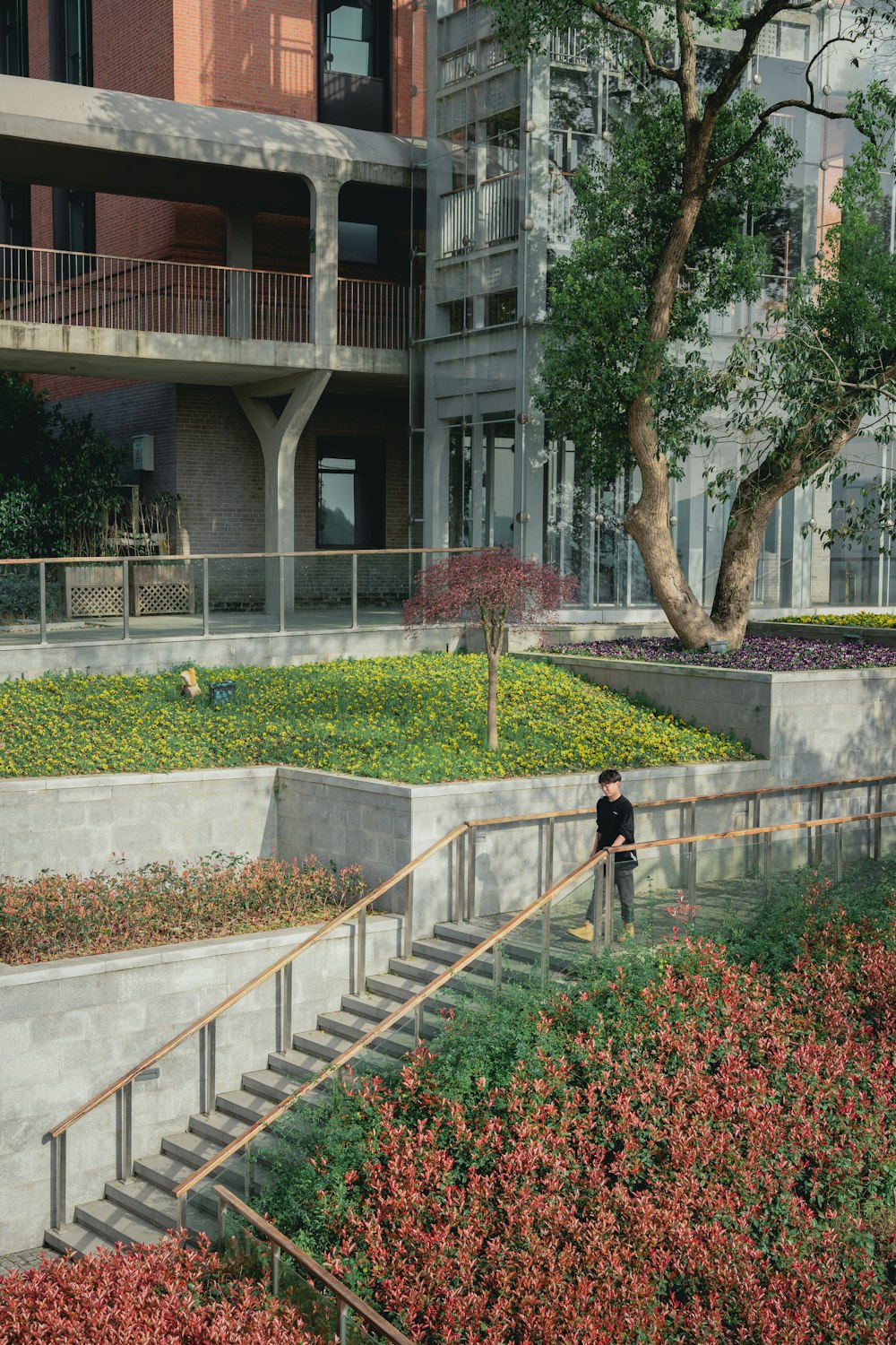 a person walking up a set of stairs next to a building