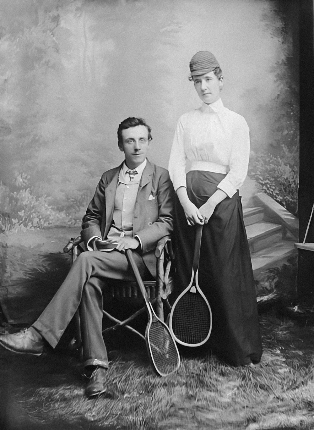 a couple of people that are holding tennis rackets