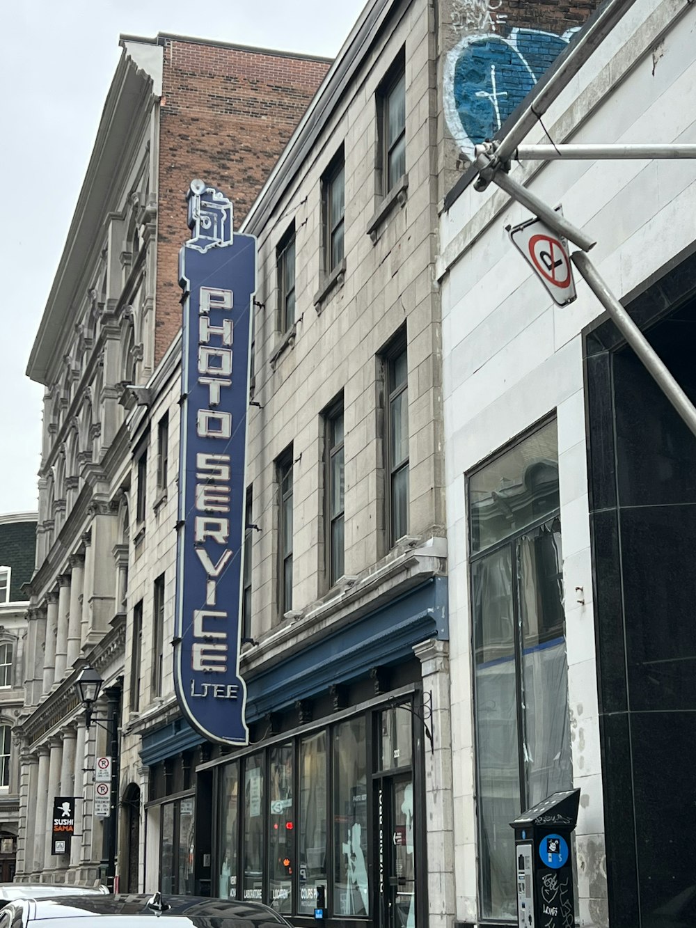 a large blue sign on the side of a building