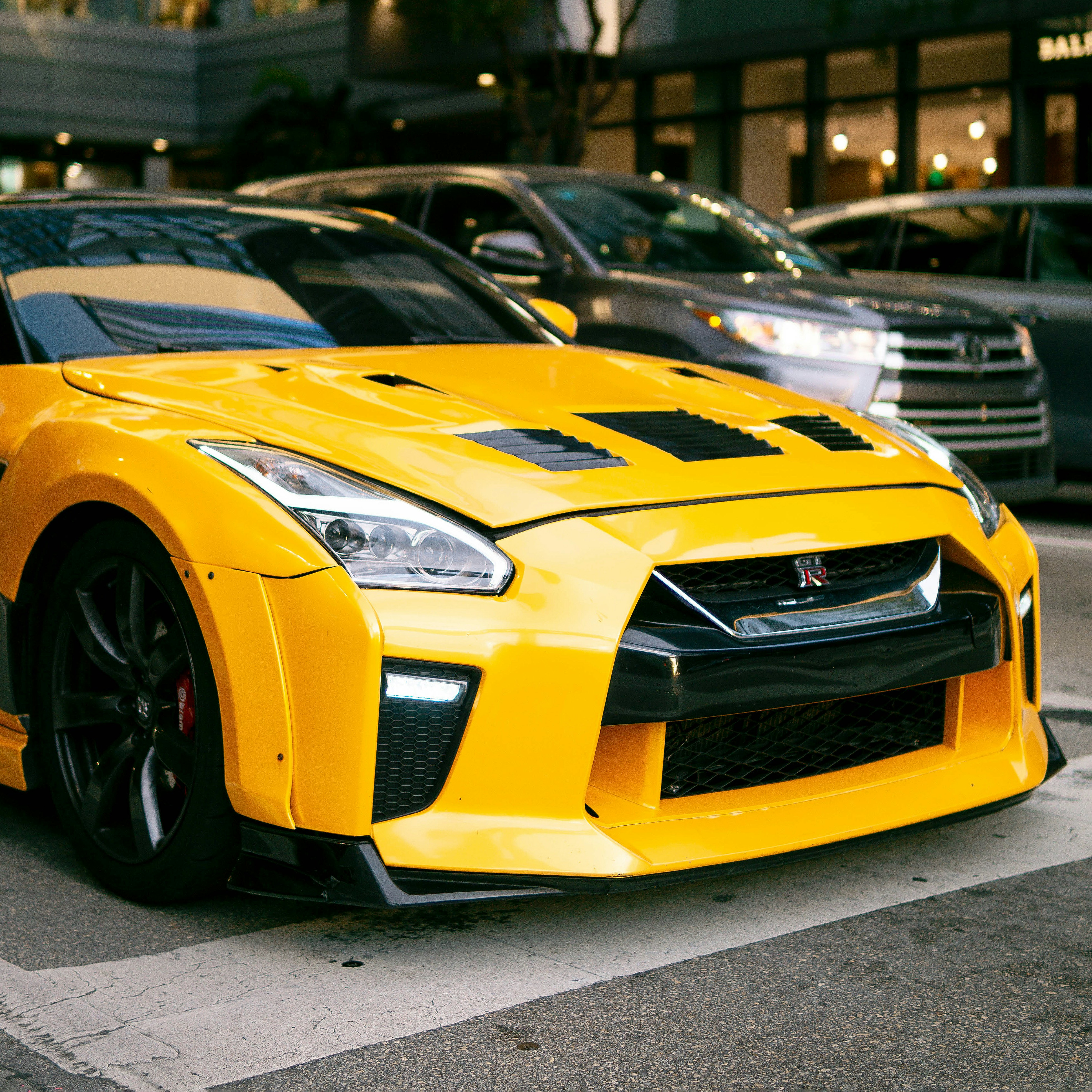 A yellow sports car parked on the side of the road photo – Free Gtr r35 ...