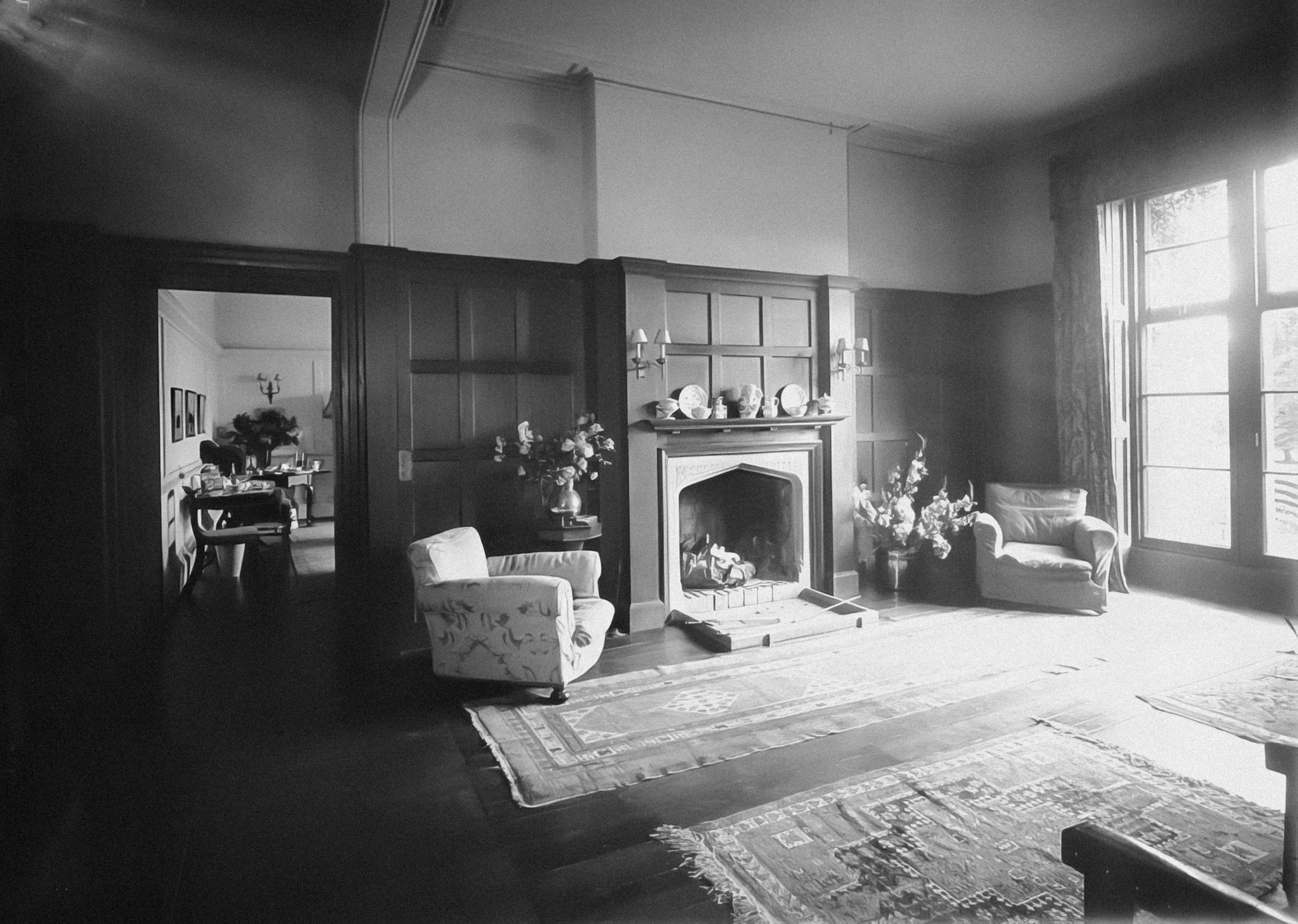 a living room filled with furniture and a fire place