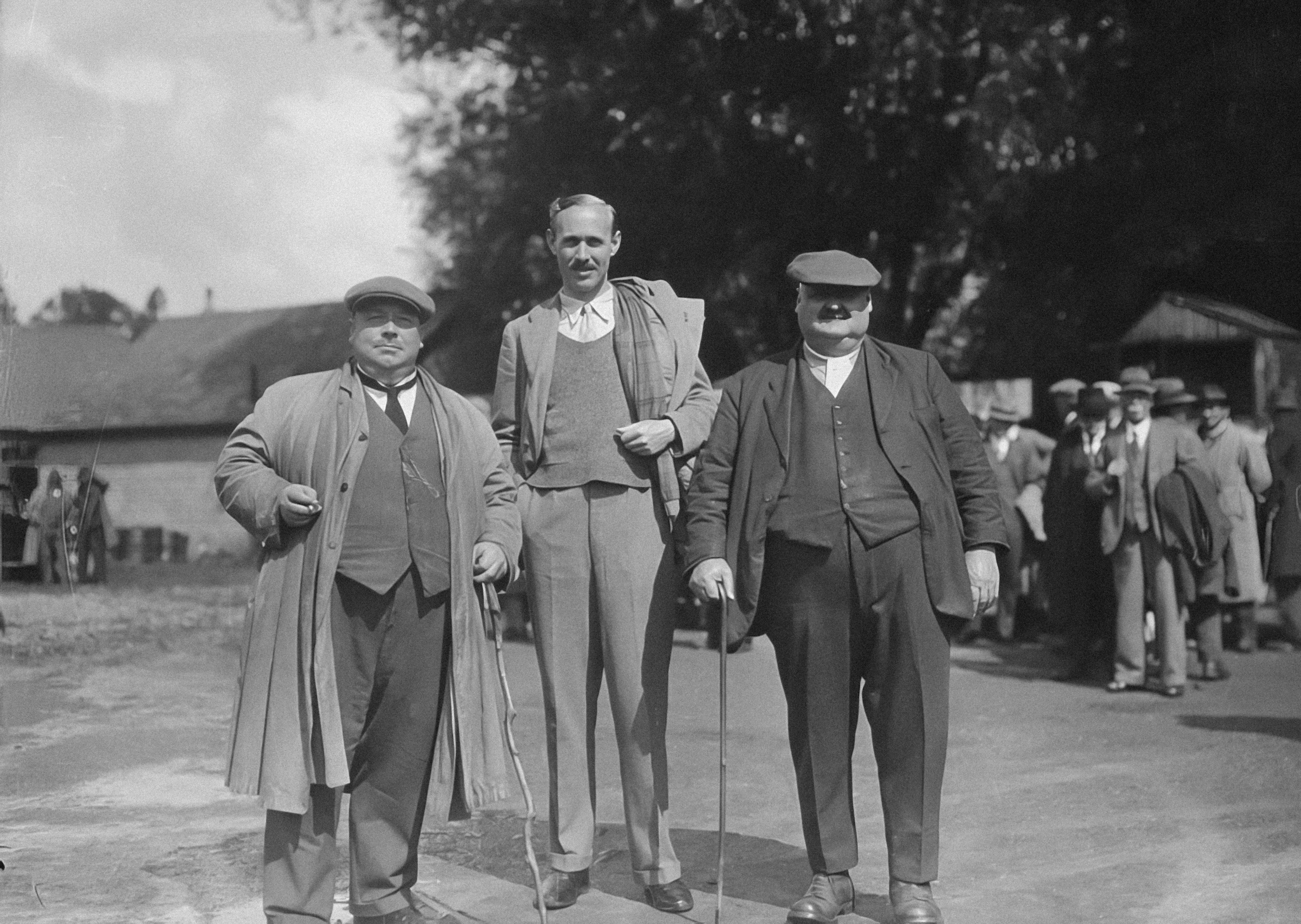 a group of men standing next to each other