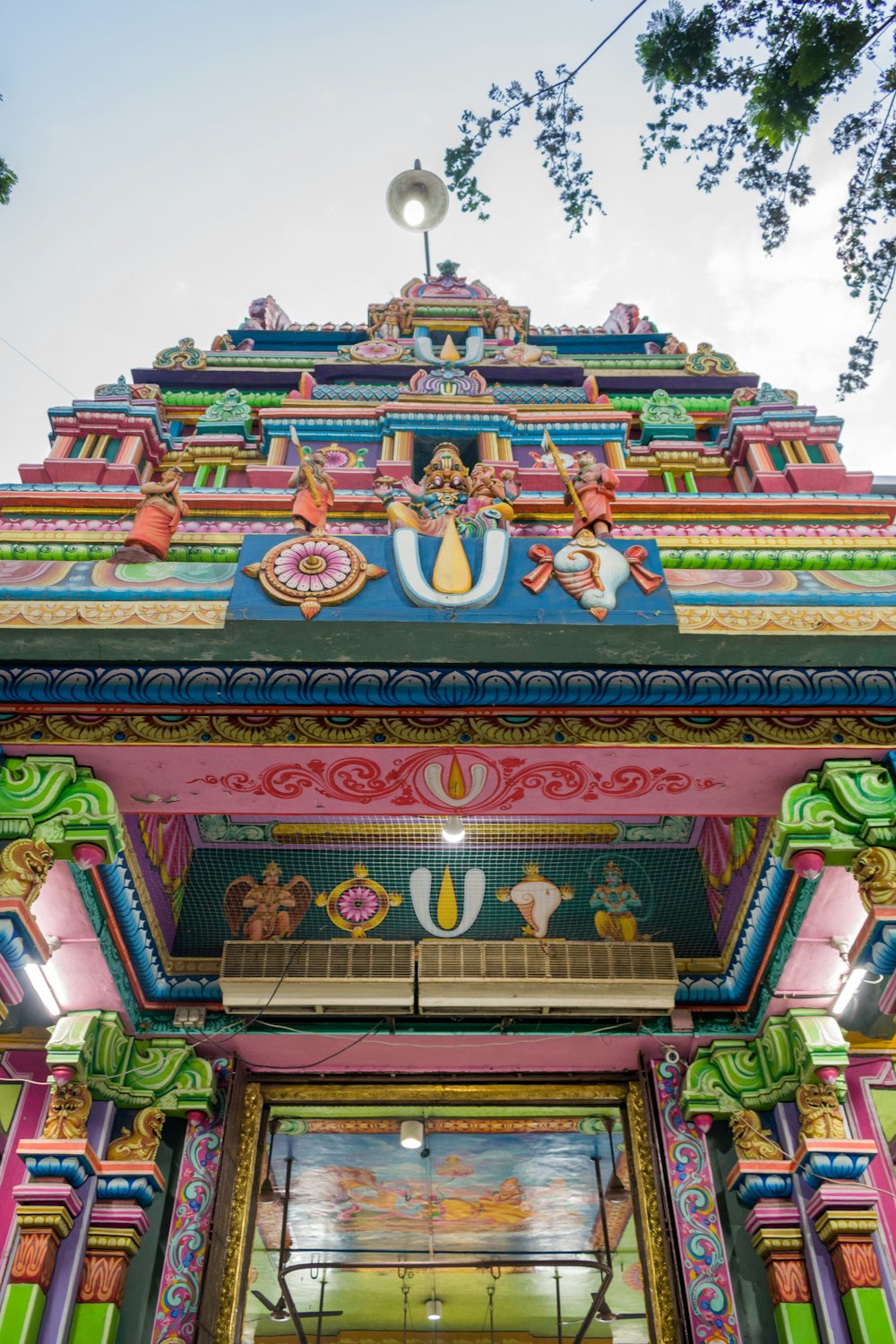 a colorful building with a clock on the top of it