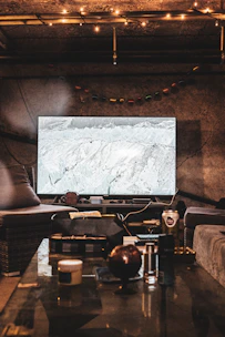 Cozy hotel room with warm lighting and modern decor in a cold mountain setting.