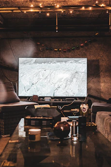 A cozy room illuminated by soft TV light showing a recent popular Turkish drama series scene.