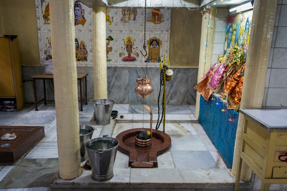 a room filled with lots of metal buckets