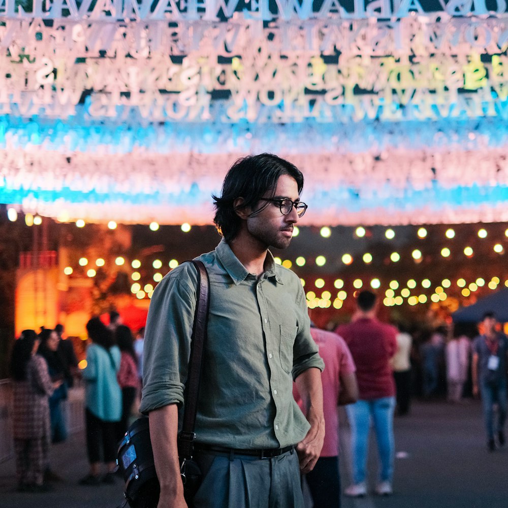 a man standing in front of a large display of lights