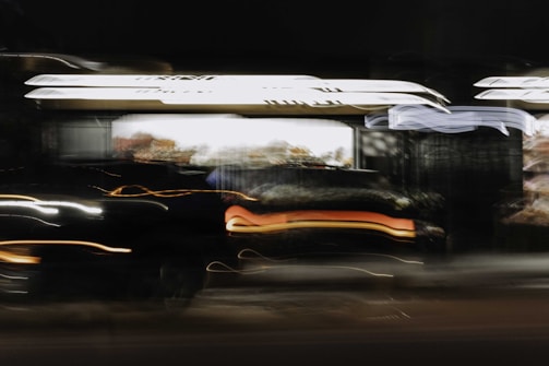 A stark, gritty street scene with blurred motion, evoking tension and mystery.