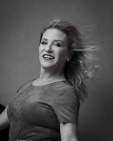 A serene studio portrait highlighting the texture and flow of a pastel-colored wrap dress.