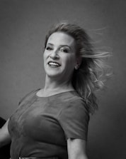 An elegant AI-generated portrait showcasing a female entrepreneur with a confident smile.