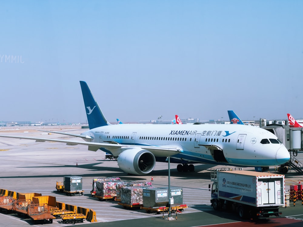 a large jetliner sitting on top of an airport tarmac