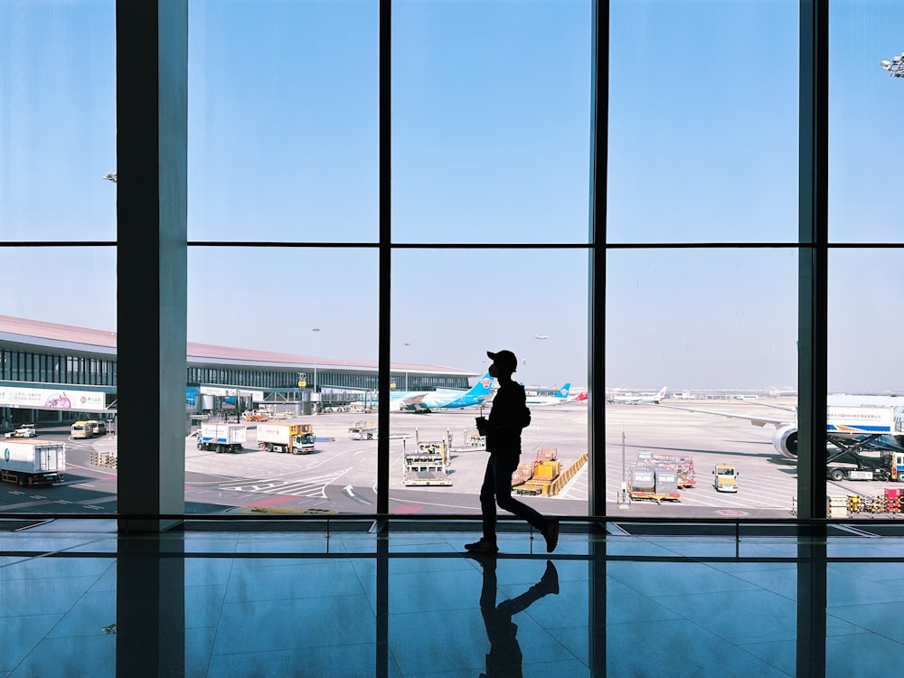 a person is walking through an airport terminal