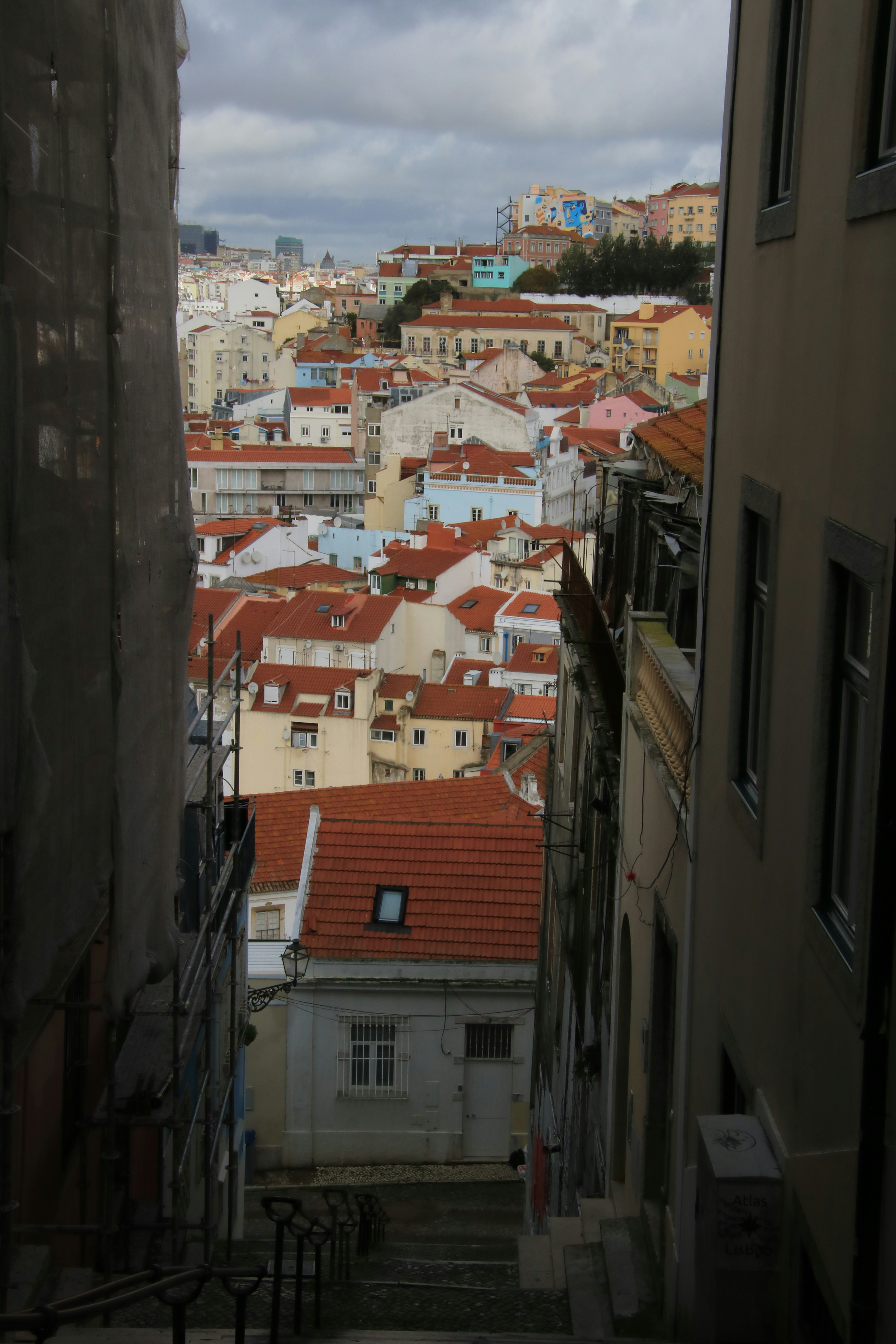 a view of a city from an alley way