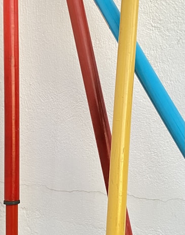 A vibrant photo showcasing a variety of pole and foam sheets used in construction.