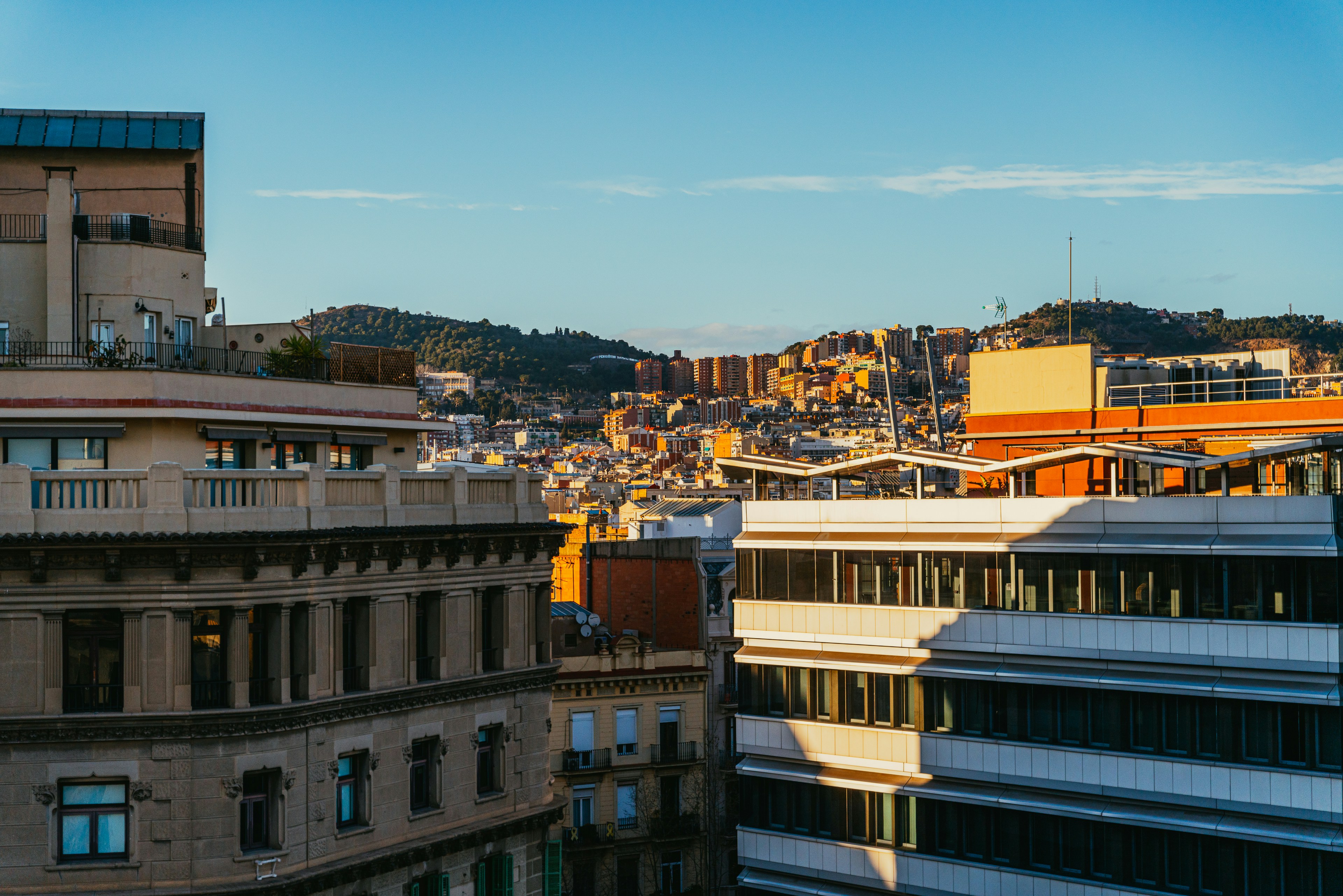 rooftop view of urban skyline at sunset - warehouse loft style apartments