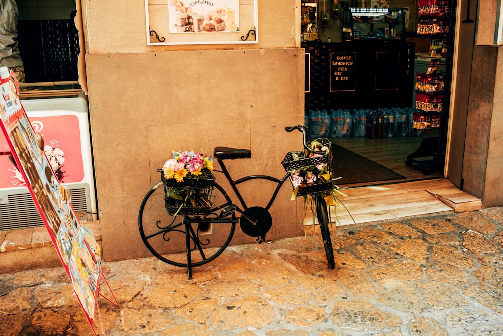 a bicycle parked next to a store front