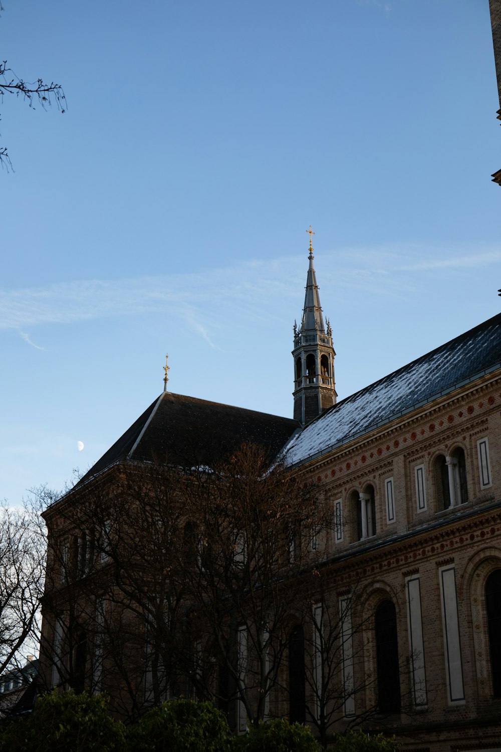 a building with a steeple and a clock tower