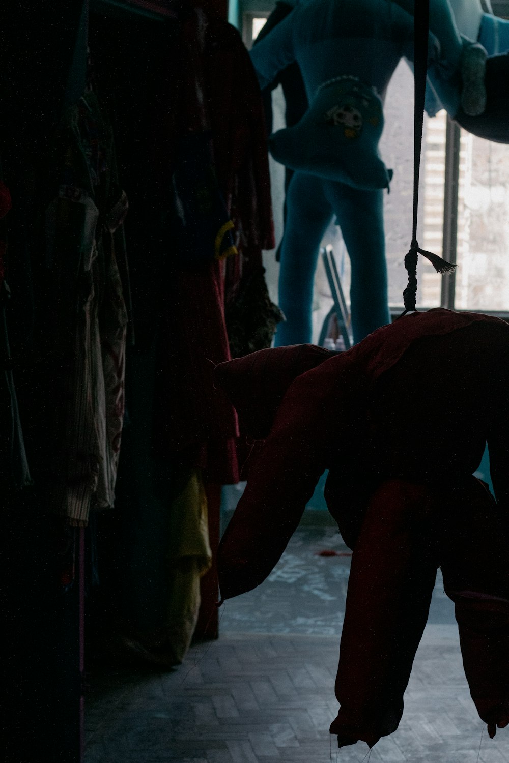 a man hanging upside down in a room