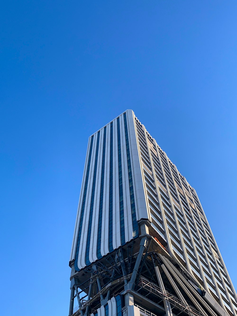 a tall building with a sky background