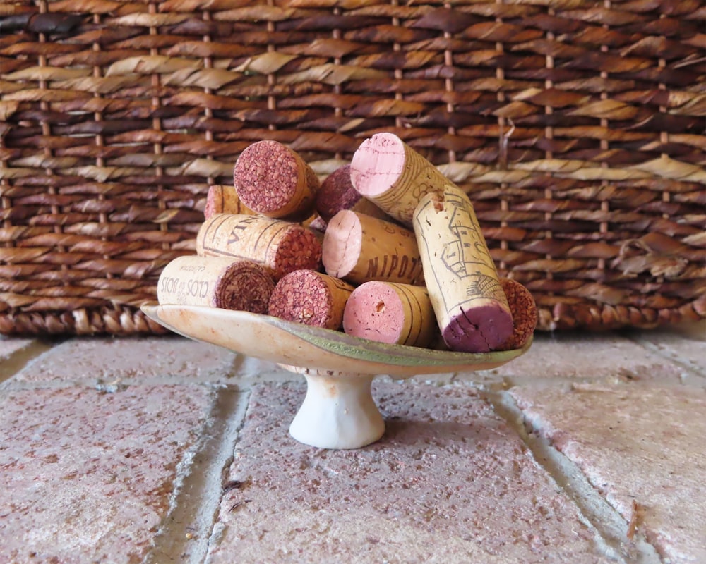 a bowl of wine corks on a table