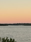 A serene view of Lake of the Woods at sunset.