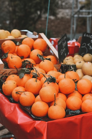 Fresh apples and pears neatly arranged in wooden crates at a local market stall.