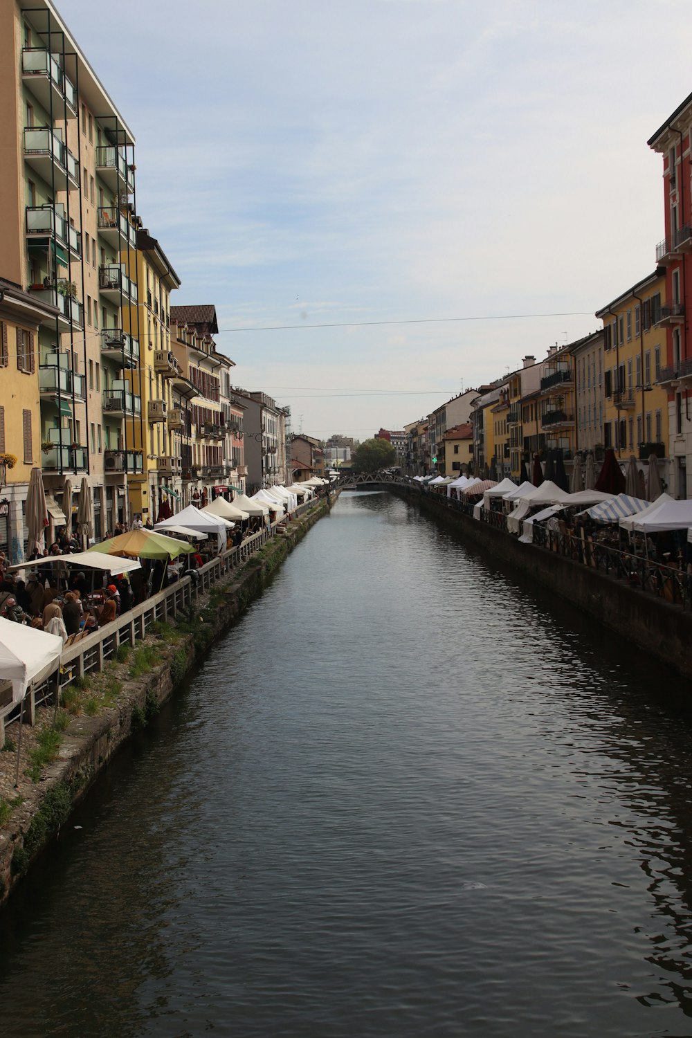 a river running through a city next to tall buildings