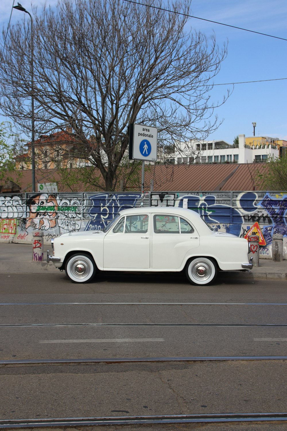 a white car parked on the side of the road