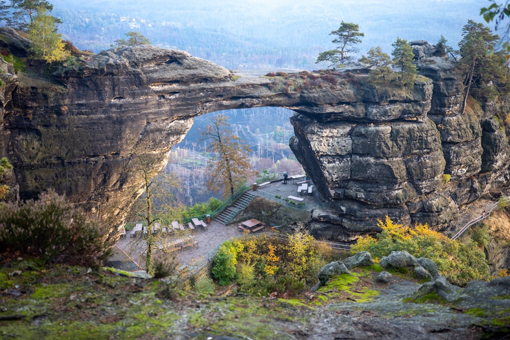 a view of a rocky cliff with a bridge over it