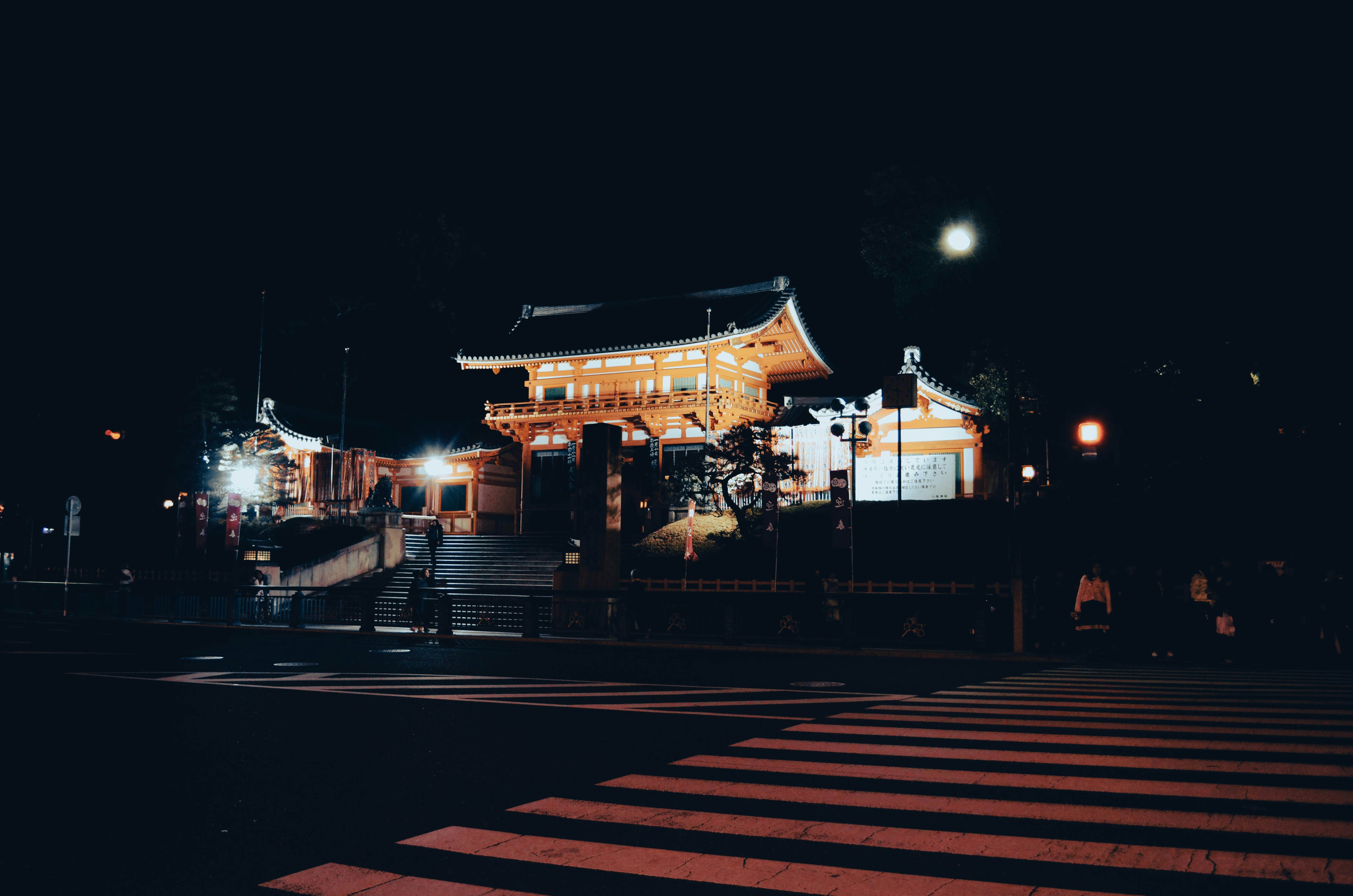 Crowd outside a Japanese temple at night for Hatsumode
